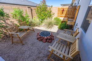 View of patio / terrace with fence and a fire pit