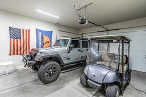 Garage featuring a garage door opener