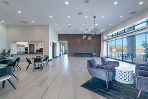Community lobby featuring a high ceiling and recessed lighting
