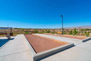 View of community featuring a game area and a mountain view