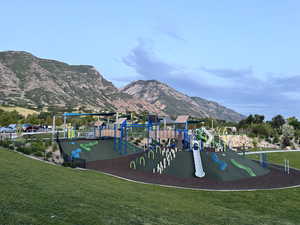 Community jungle gym with a mountain view