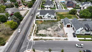 Aerial perspective of suburban area featuring a main thoroughfare