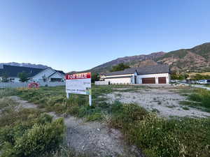 Exterior view of mountains and dirt driveway