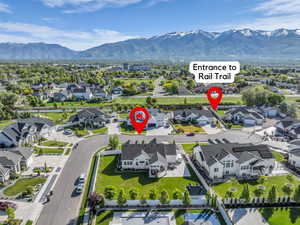 Aerial view of residential area featuring a mountainous background