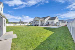 View of yard with a patio and a residential view