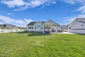Rear view of house featuring a patio and stucco siding
