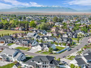 Aerial view of residential area featuring a mountain backdrop