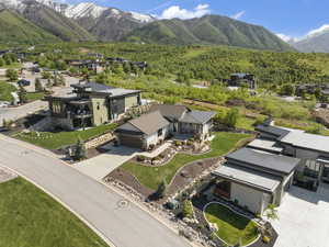Aerial perspective of suburban area with a mountainous background