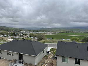 View of subject property with a mountain backdrop
