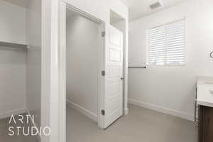 Bathroom with vanity and baseboards
