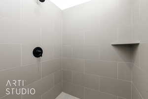 Full bathroom with tiled shower