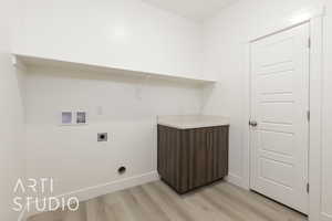 Laundry room featuring hookup for an electric dryer, light wood-type flooring, washer hookup, and baseboards
