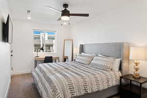 Bedroom featuring baseboards, carpet floors, recessed lighting, and a ceiling fan