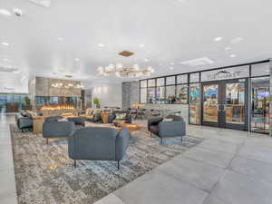 Community lobby featuring floor to ceiling windows and recessed lighting