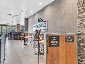 Reception area with floor to ceiling windows and recessed lighting