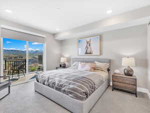 Bedroom with access to exterior, carpet floors, recessed lighting, and baseboards