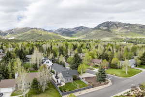 Aerial view of residential area featuring a mountainous background