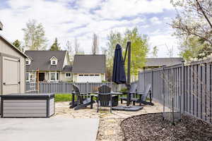 View of patio / terrace with a fenced backyard and a fire pit