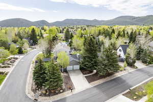 Aerial view of residential area featuring a mountainous background