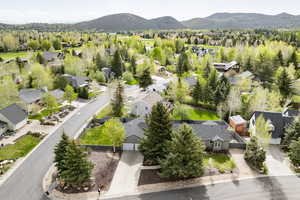 Aerial view of residential area featuring mountains