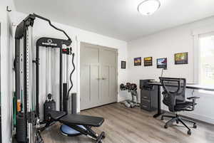 Office space featuring wood finished floors and baseboards