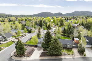 Aerial perspective of suburban area featuring a mountain backdrop
