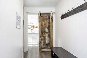 Corridor with dark wood-style flooring