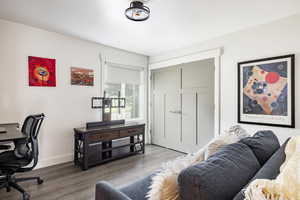 Office space featuring wood finished floors and baseboards
