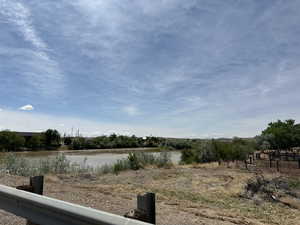 View of yard with a water view