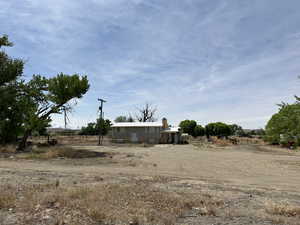 View of yard featuring central air condition unit and a view of rural / pastoral area