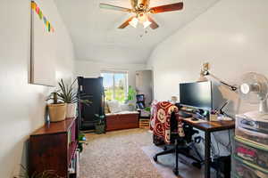Back Unit's Bedroom featuring vaulted ceiling, light colored carpet, and ceiling fan