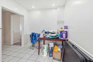 Bathroom featuring tile patterned floors and baseboards