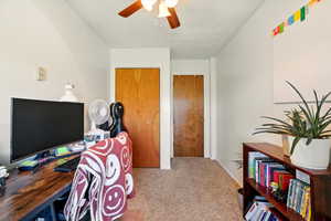Back Unit's Bedroom with carpet floors, ceiling fan, and baseboards