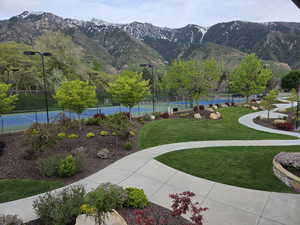 View of home's community featuring a tennis court and a mountain view