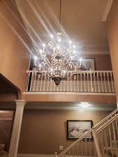 Detailed view of decorative columns and a chandelier