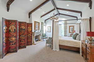 Bedroom with recessed lighting, carpet flooring, a chandelier, and a premium fireplace