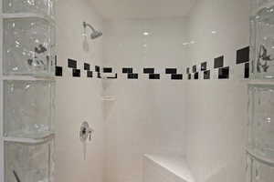 Full bath with a tile shower