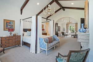 Bedroom with a chandelier, arched walkways, beam ceiling, recessed lighting, and carpet