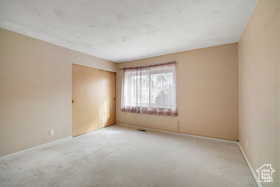 Spare room with carpet flooring and baseboards