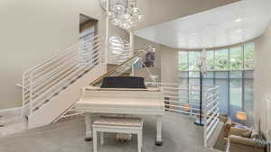 Living area with stairway, carpet floors, and recessed lighting