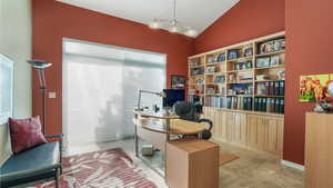 Home office featuring vaulted ceiling