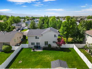 Aerial view of residential area featuring mountains