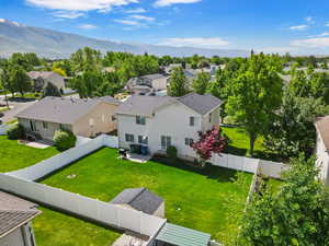 Aerial perspective of suburban area with a mountainous background