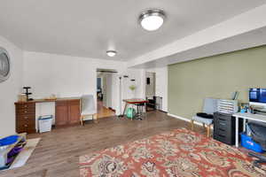 Office featuring wood finished floors and baseboards