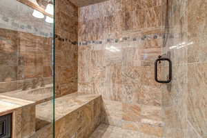 Bathroom featuring a tile shower