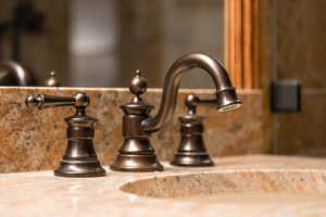 Bathroom view of a sink and decorative backsplash