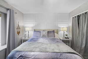 Bedroom with a decorative wall