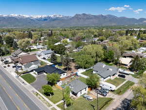 Aerial perspective of suburban area with a mountain backdrop