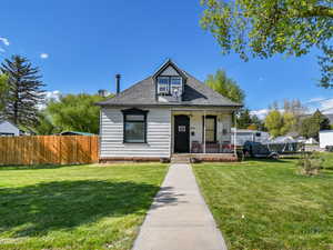 Bungalow with a porch and a shingled roof