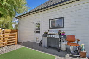 Wooden deck with fence and grilling area